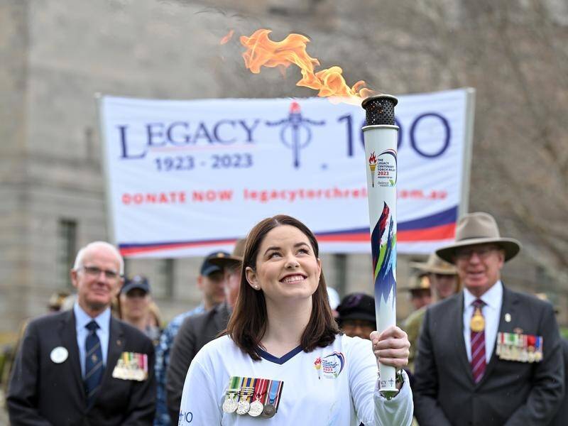 Legacy's torch reached Canberra on a relay marking 100 years of the charity for veterans' families. (Mick Tsikas/AAP PHOTOS)