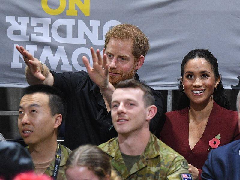 Prince Harry and Meghan cheer on the teams in the wheelchair basketball final at the Invictus Games.