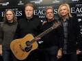 Handwritten song lyrics to classics from The Eagles (pictured) are at the centre of a criminal trial (AP PHOTO)