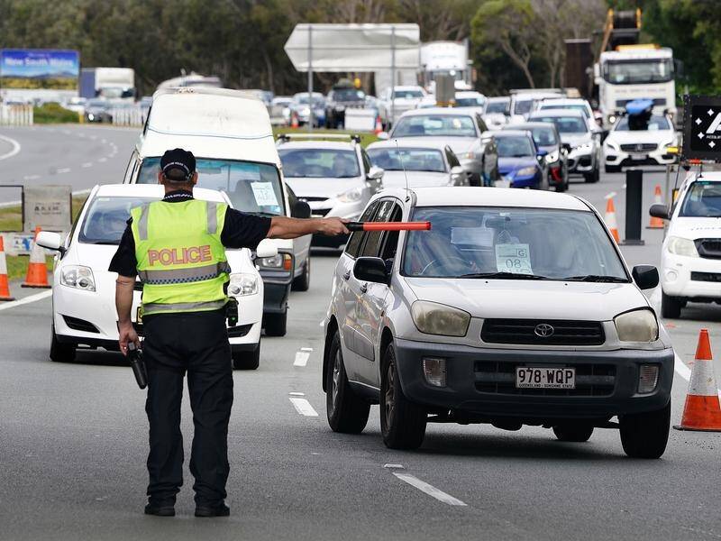 Police say travellers continue to arrive at Queensland's borders in extraordinary numbers.