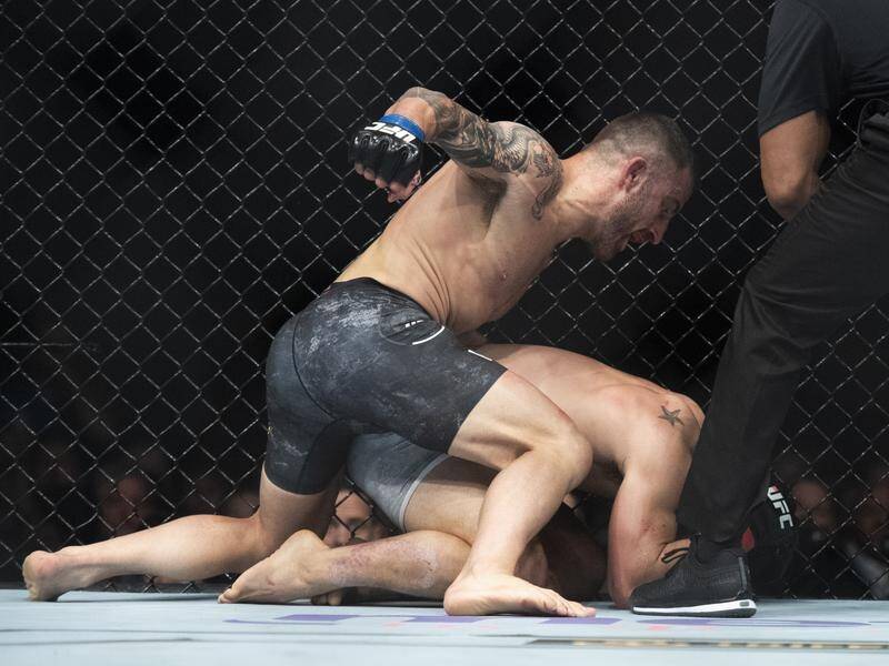 Australian UFC hope Alexander Volkanovski lays into one of his opponents earlier this year.