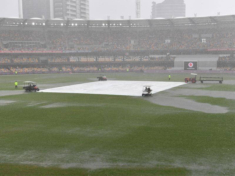 A storm in Brisbane brought an early end to play on day two of Australia's fourth Test with India.