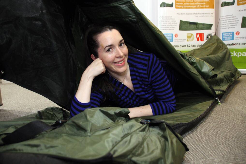 Swags for Homeless operations manager and co-founder Lisa Clark models the organisation's portable bed, which is helping to give Australia's homeless people a warm, dry place to sleep at night. Photo by Chris McCormack