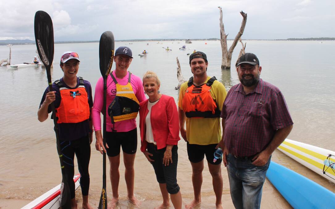 Paddlers Ryan Paroz, left, (second placegetter) and Jy Duffy, second from left, (first place- getter) with Redland mayor Karen Williams, centre, fellow paddler Tim Burdiak (third place- getter) and Redland councillor Mark Edwards.