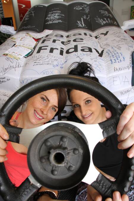Maeve Lane, 20 of Ormiston and Courtney Black, 25 of Alexandra Hills checked out the Fatality Free Friday inflatable car at Redland City Council.Phot by Chris McCormack
