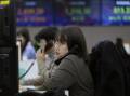 MSCI's broadest index of Asia-Pacific shares fell 1.7 per cent after diving as much as 2.6 per cent. (AP PHOTO)