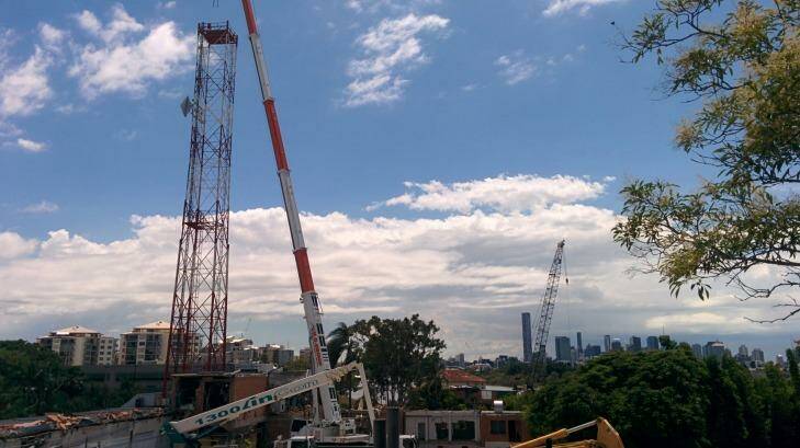 The antenna tower at the old ABC studios in Toowong is demolished on Monday, February 2. Photo: Jorge Branco