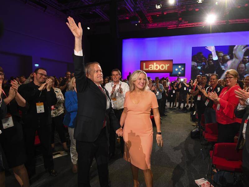 Bill Shorten, seen with wife Chloe, says his team is ready to govern.