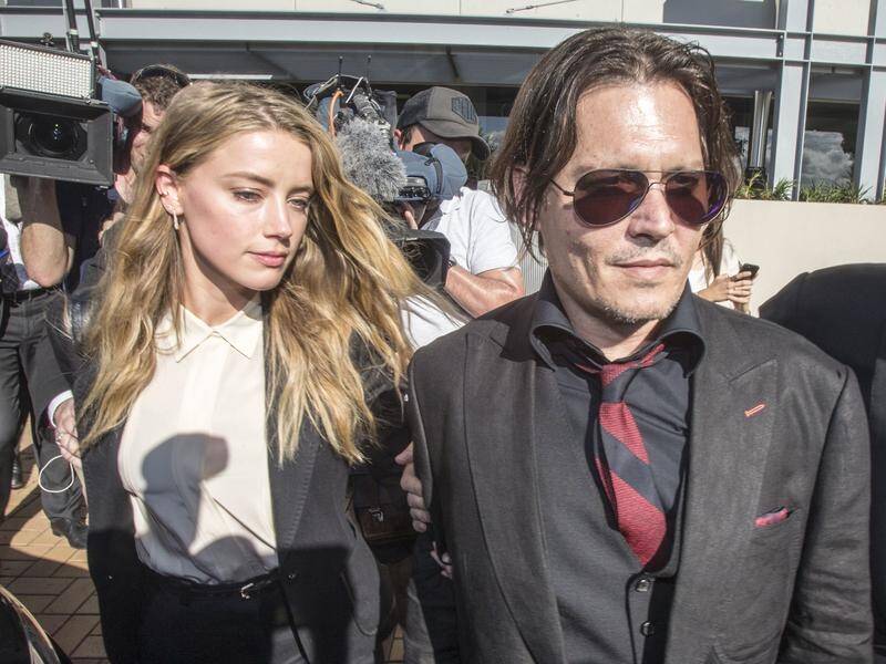 Police and ag officials are again investigating Amber Heard (left) over the Pistol and Boo saga.