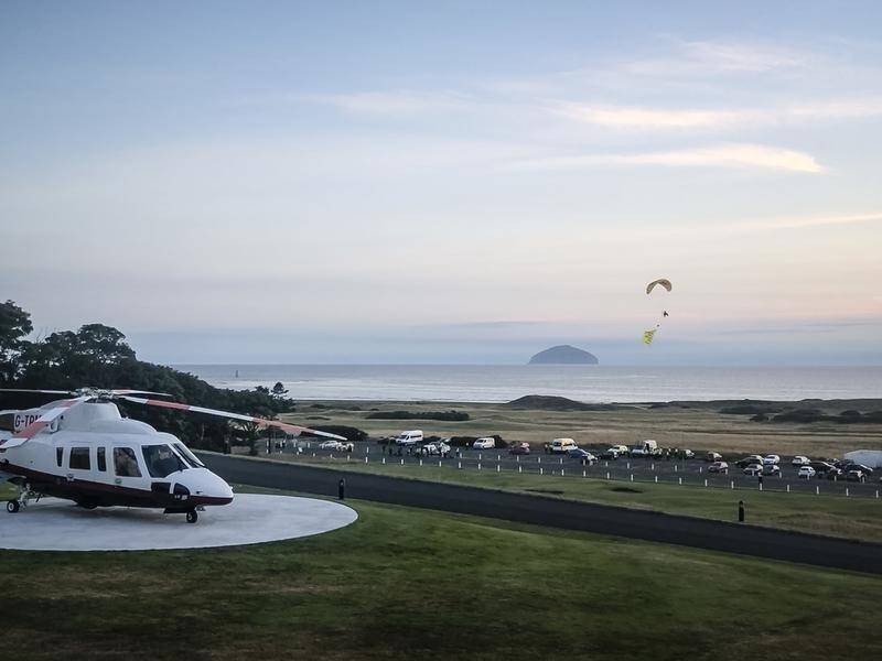 A man has been arrested over a paraglider protest at Donald Trump's Scottish golf resort.