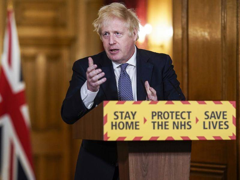 UK Prime Minister Boris Johnson says people must stick with restrictions to slow COVID-19's spread.