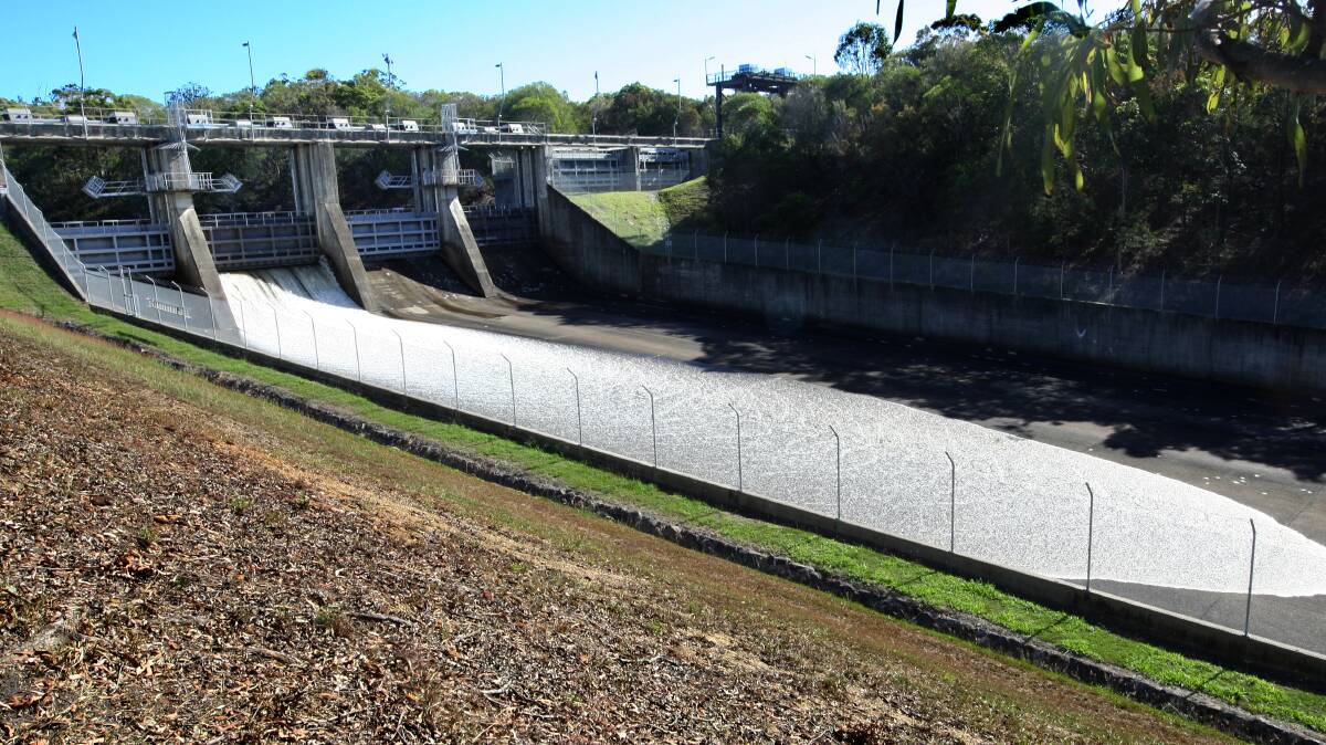 Water spills out of Leslie Harrison Dam as Seqwater gets its maintenance program under way. PHOTO: Stephen Archer