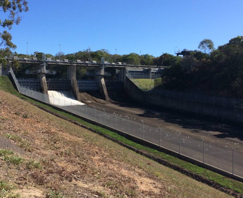 Water spills out of Leslie Harrison Dam as Seqwater gets its maintenance program under way. PHOTO: Judith Kerr