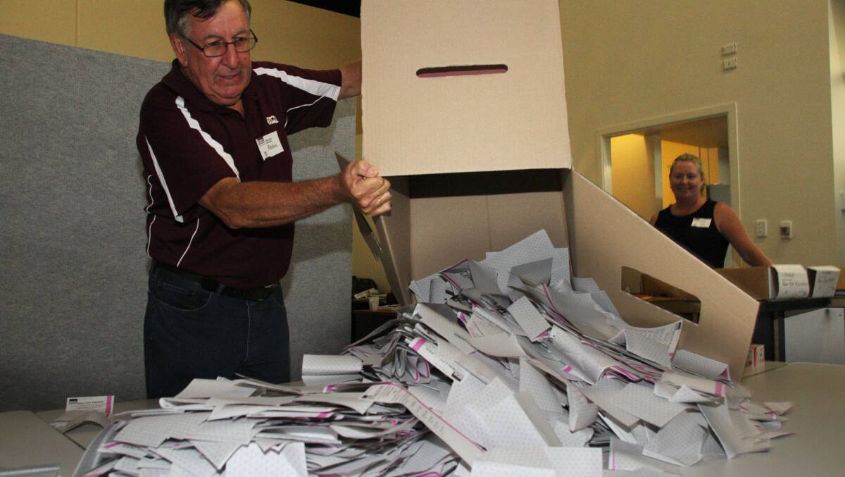 Returning Officer for the Redlands Robin Spann empties a box of pre-poll votes to be counted.
Photo by Chris McCormack