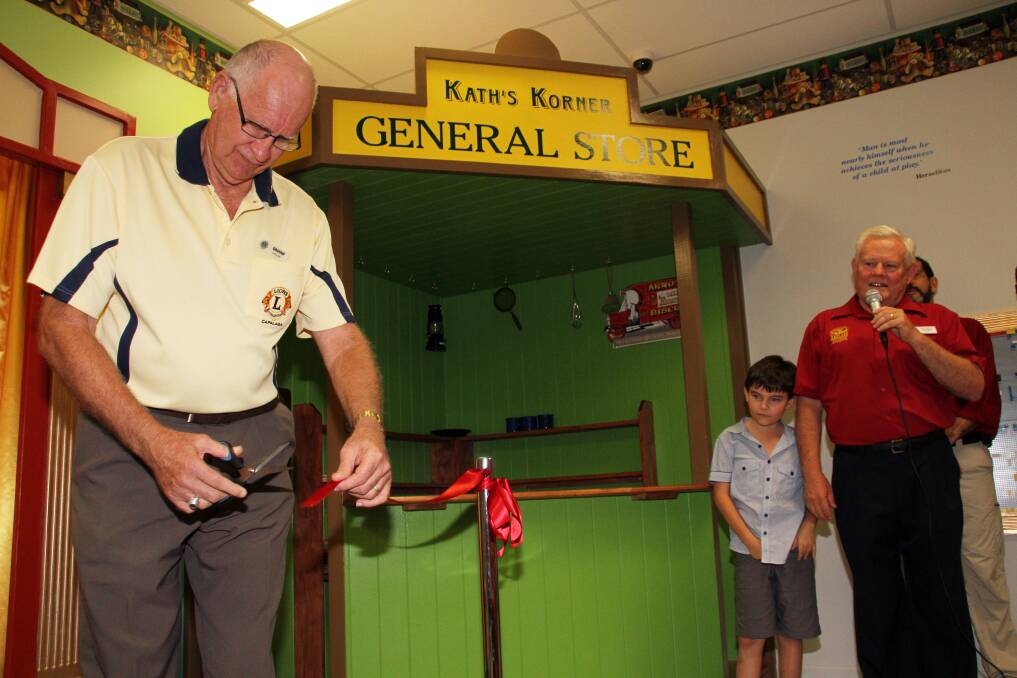 Redland Museum Open Day and official opening of the Australian Toy Hall of Fame: Lions Club of Capalaba president Graham Erickson cuts the ribbon to officially open the Australian Toy Hall of Fame at Redland Museum. Photo by Chris McCormack 