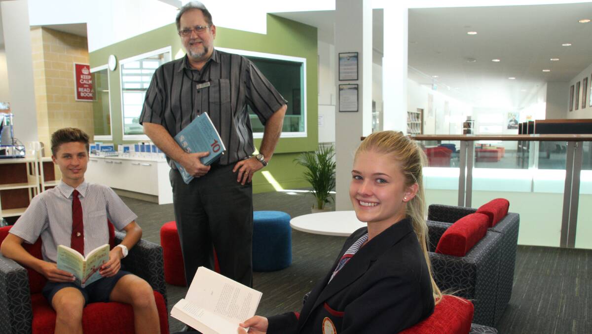 Carmel College year 9 student, Jack Bloomfield, teacher librarian Tony Ogden and year 11 student Georgia Bradley enjoy their school's new library.
Photo by Chris McCormack