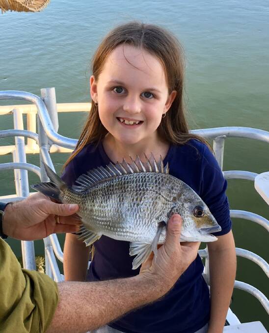 PROUD: Not keen on holding it, but Abby Stabb loved catching a 35cm bream from the Tweed River.