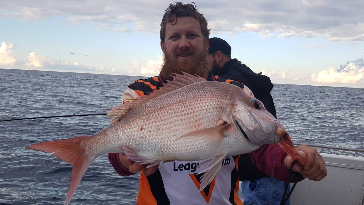 PERFECTION: Brett Hubner with a perfect eating size snapper caught offshore.