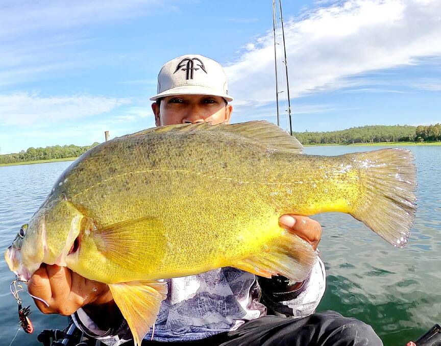 NICE ONE: Khean Mak hiding behind a solid lure caught yellowbelly.