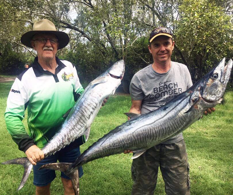 BIG CATCH: Ross Collison and Jason May holding up two big Spanish mackerel caught off the Sunshine Coast.