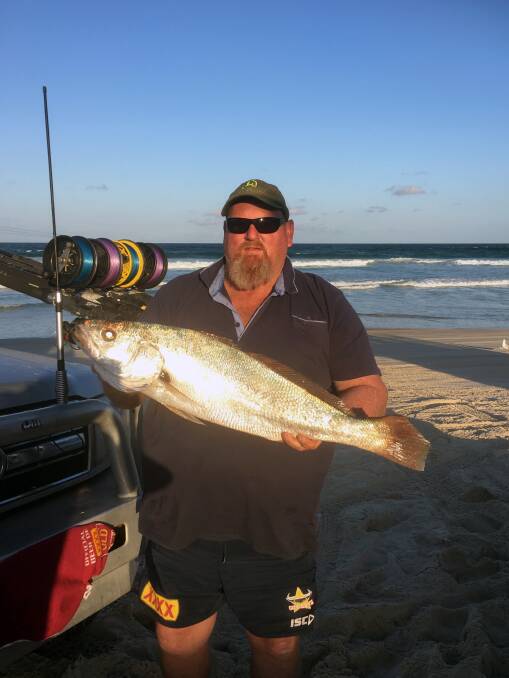 CATCH: Brett McKenzie with a mulloway from the Eastern Beach on Moreton Island.