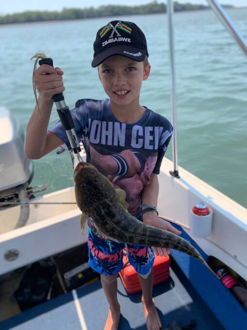 BEST CATCH: Nine-year-old Samuel Olsen trolled up a personal best flathead, measuring 63cm from Russell Island.