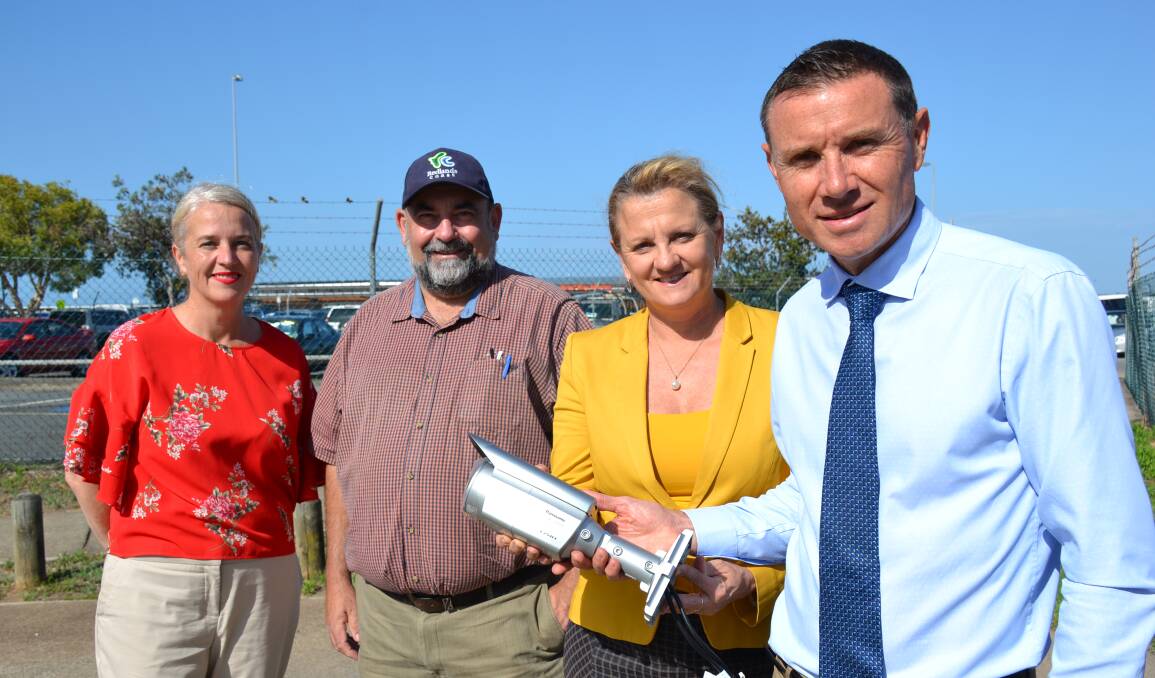 State Member for Redlands, Kim Richards, Redland City Mayor Karen Williams, Division 5 Councillor Mark Edwards and Federal Member for Bowman, Andrew Laming inspect one of the security cameras onsite at Weinam Creek marina.