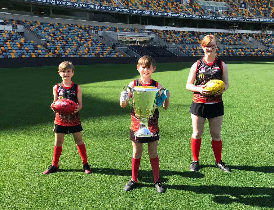 Redbacks Little stars: Hamish Carr, Milan Wellington and Ryden Clarke at the Gabba. They starred in a bid to get the AFL Grand Final to Brisbane.