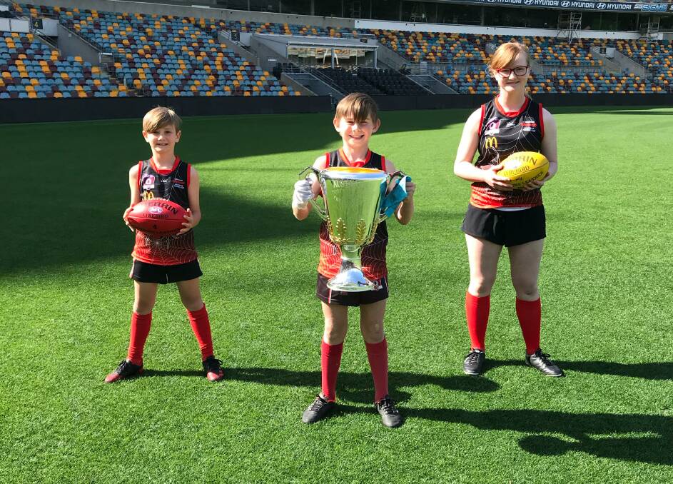 Big prize: Hamish Carr, Ryden Clarke and Milan Wellington with the premiership cup.