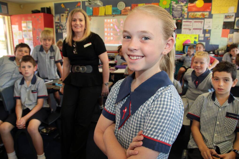 Top marks... St Anthony's Year 4 student Keely Askew won a NAIDOC Prime Ministers award for poem entitled Reconciliation. Her teacher Terri Griffiths was "super proud".Photo by Chris McCormack
