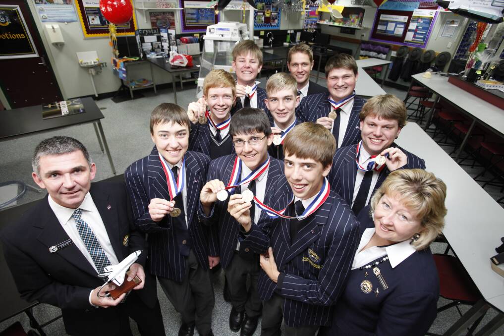 GOLD medal winning performance: Clebrating their aerospace victory are Sheldon College staff and students (back to front)  Kristopher Anderson,  Michael Rohweper, Brayden Douglas, Scott Wright, Toby Duffy, Mathew Field, Dr David Hughes, Ben Eliasaf, Nathan Obermuller, Alex Grimshaw-Jones and Mrs Diane Vandermeer. Photo: Melissa Gibson