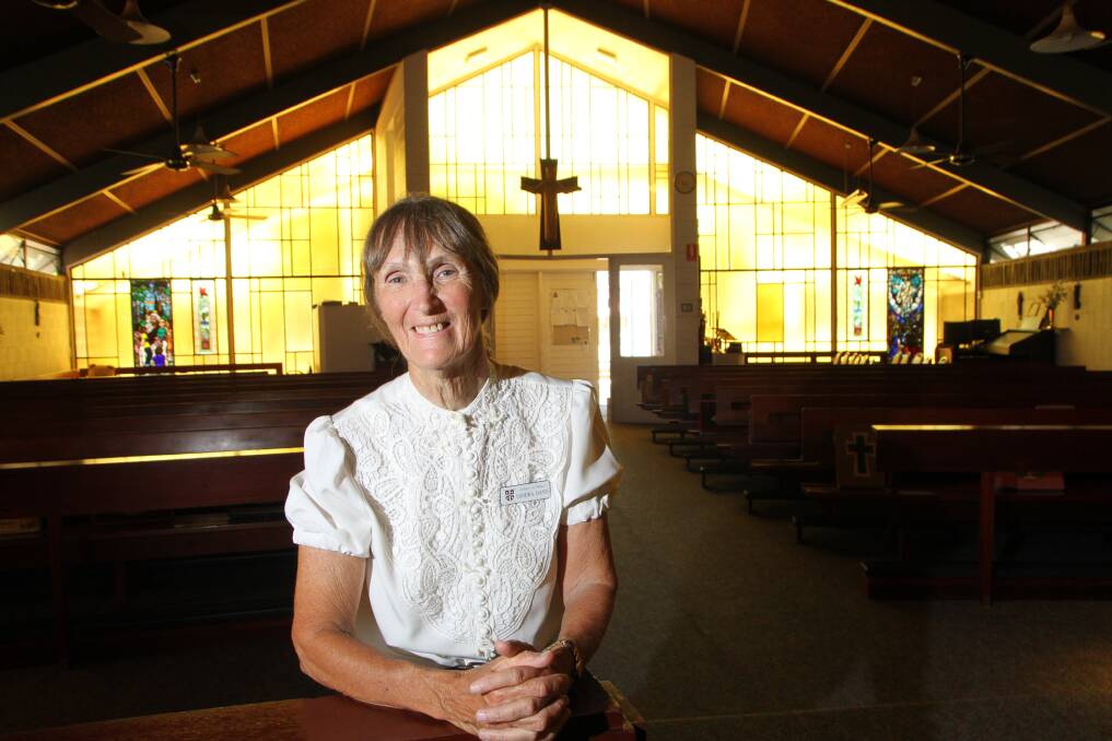 DOUBLE CELEBRATION: Sandra Davis stands inside St Paul s Anglican Church, Manly, which will turn 50 in November  the same month its hall turns 100.