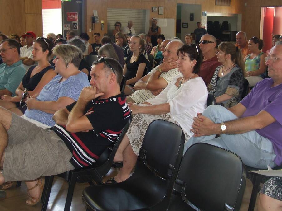 Residents listen as a panel of four gives details of plans for a power plant at Mount Cotton. Photo: Judith Kerr