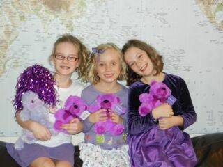 Celebrating Purple Day to raise money for kids with epilepsy are (from left) Maisy Eckersley, Zoe Duddridge and Sophie Eckersley.
