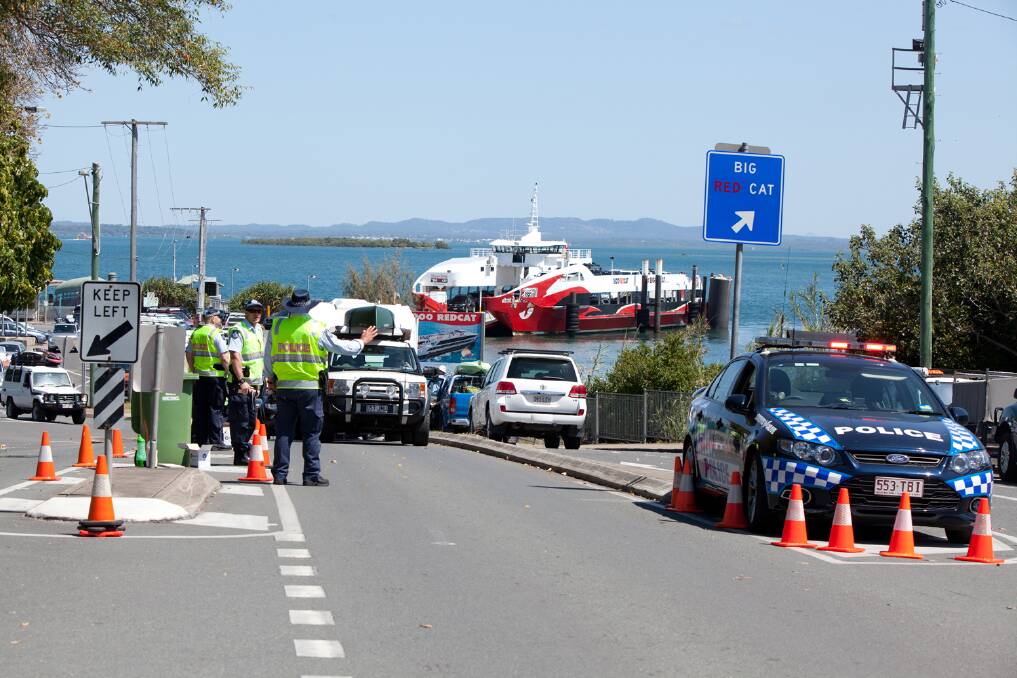 Police check vehicles and conduct RBTs at the start of the school holiday influx of tourists to North Stradbroke Island. Photo by Julie Sisco