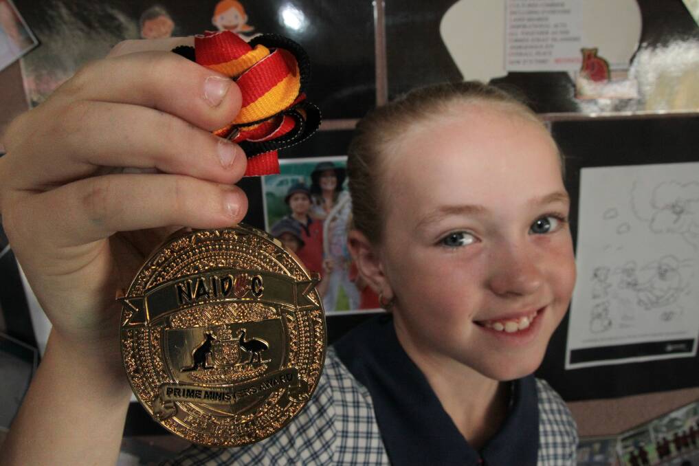 Top marks... St Anthony s year 4 student Keely Askew won a NAIDOC Prime Minister s award for poem entitled Reconciliation. Photo by Chris McCormack