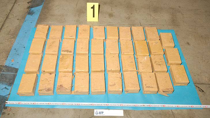 Three men allegedly used a wooden altar to smuggle heroin into Brisbane.