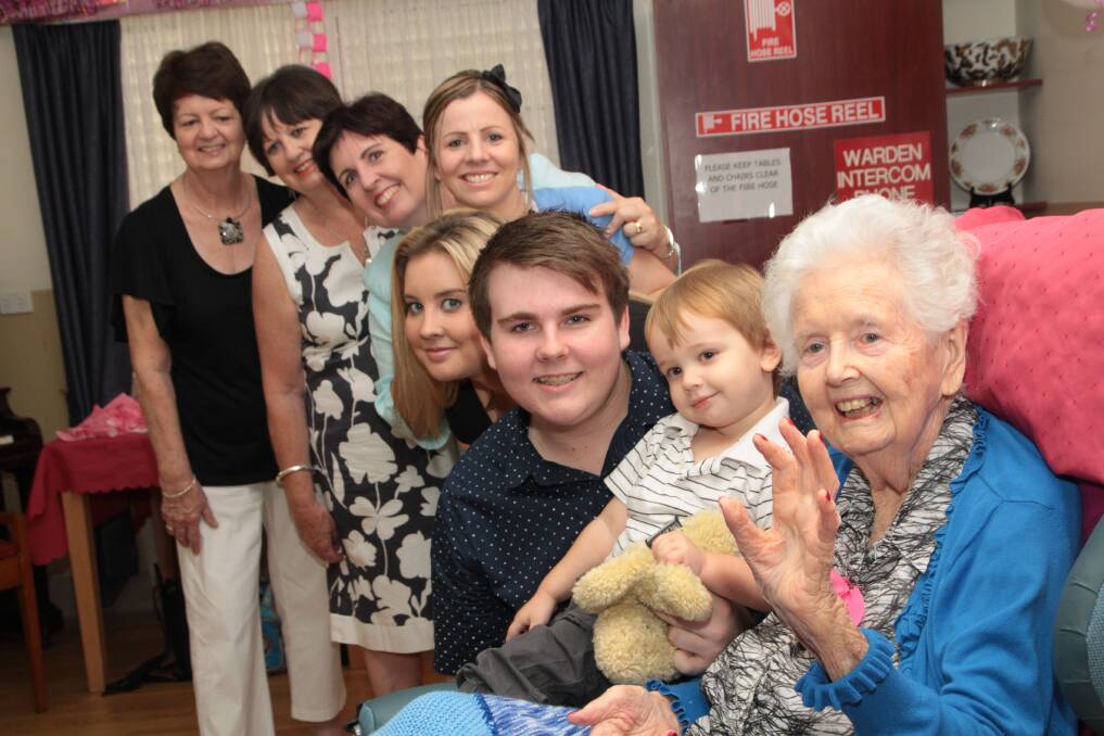 Molly Kennedy is given a 101st birthday party at Sylvan Woods aged care facility. Joining the party are five generations (front to back) Molly, great great-grandson William Bennett, 2, great-grandchildren Zach,18, and Tara Bennett, 20, all of Capalaba, grandchildren Diana Swinburne, of South Melbourne, and Jacinta Bennett, of Wellington Point, and children Maureen Swinburne, of South Melbourne, and Patricia Bignell, of Cleveland.  Photo: Chris McCormack
