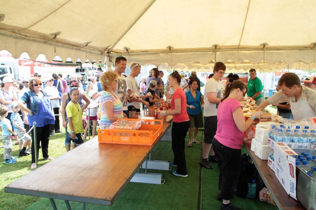 Snags galore… More than 1000 people visited Mondays Redland Easter Family Festival including several patient people who lined up for a sausage.