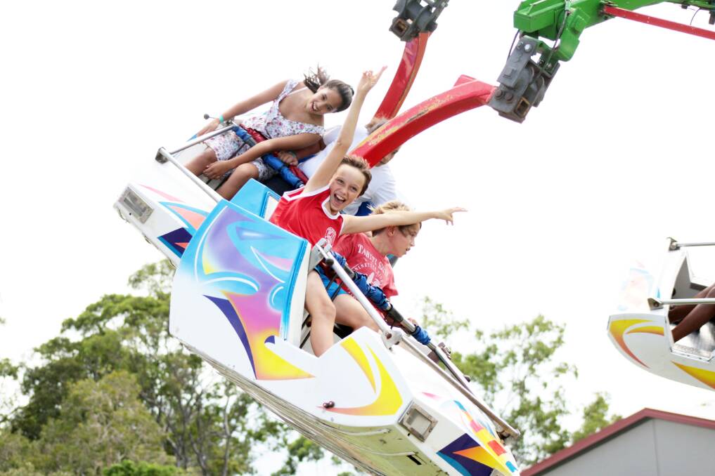 Having a ball… brothers Ryan, 10 and Jarrod Cadogan, 9 enjoyed taking a spin together one of the many free rides at the Redland Easter Family Festival.