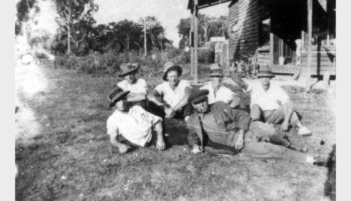 Bird’s corner store, on the corner of Redland Bay Road and Colburn Avenue, Victoria Point -  Joe Bird lying down [front right] with the Echardt boys  