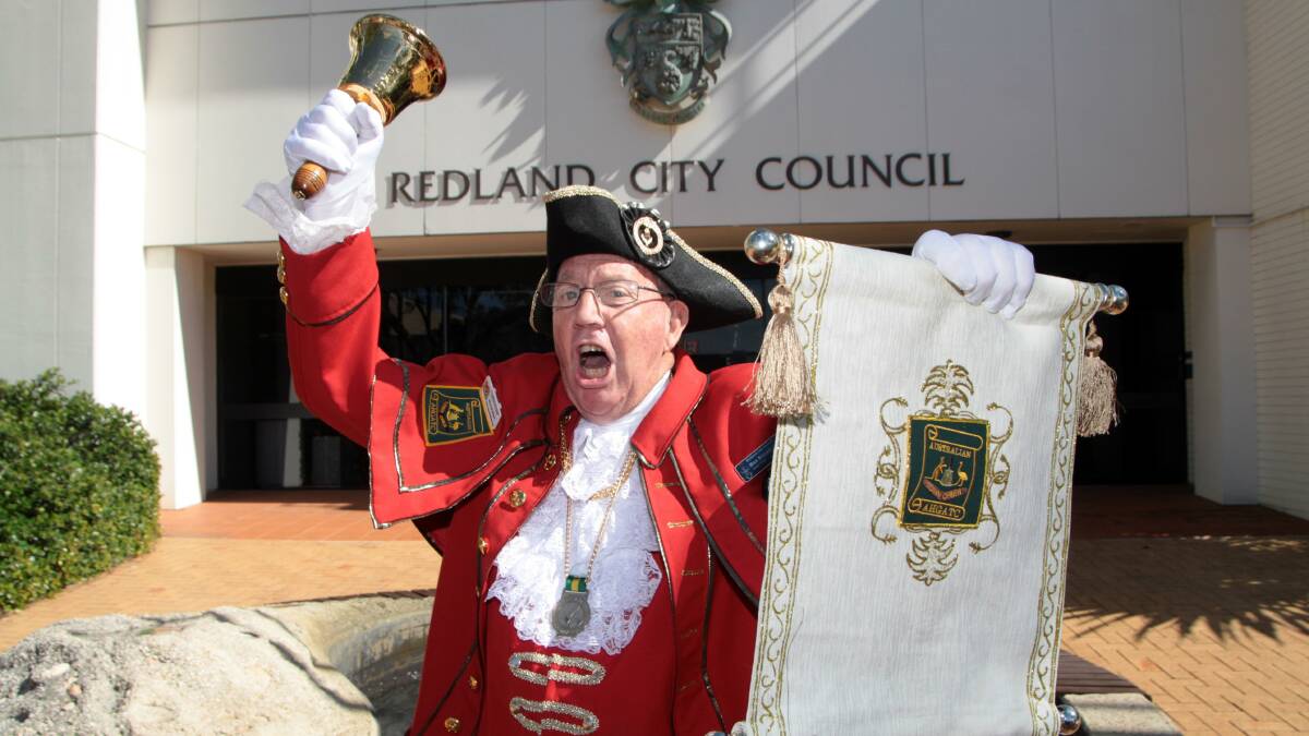 Redland City Town Crier Max Bissett announces the arrival of the Royal baby outside the Redland City Council Chambers this morning.