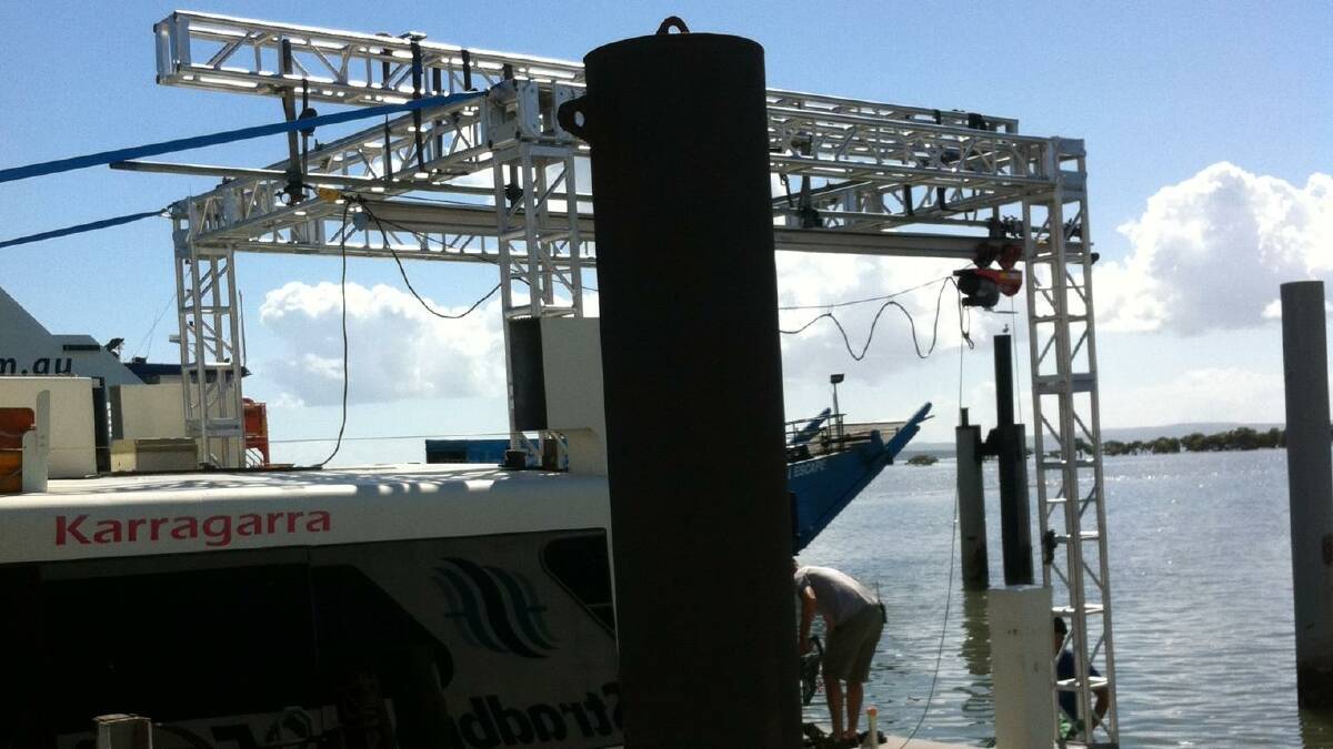 Rigging on a ferry as part of the Unbroken film shoot on Moreton Bay..
