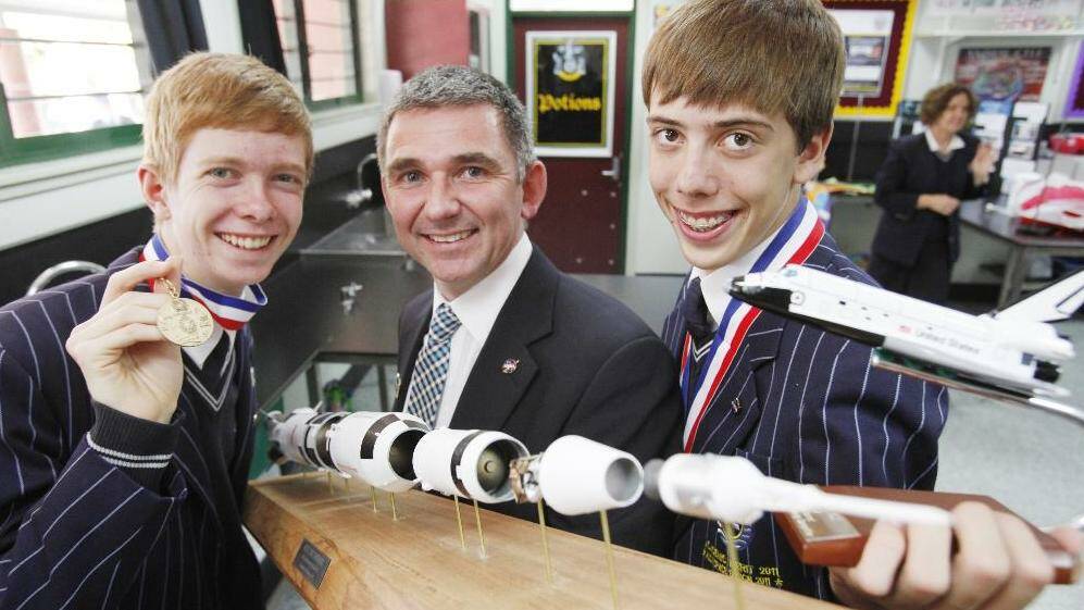 Sheldon College students (from left) Toby Duffy and Nathan Obermuller, with science faculty leader Dr David Hughes,  were part of the team that won the  prestigious annual International Space Settlement Design Competition at the Johnson Space Centre in the USA.  Photo: Melissa Gibson