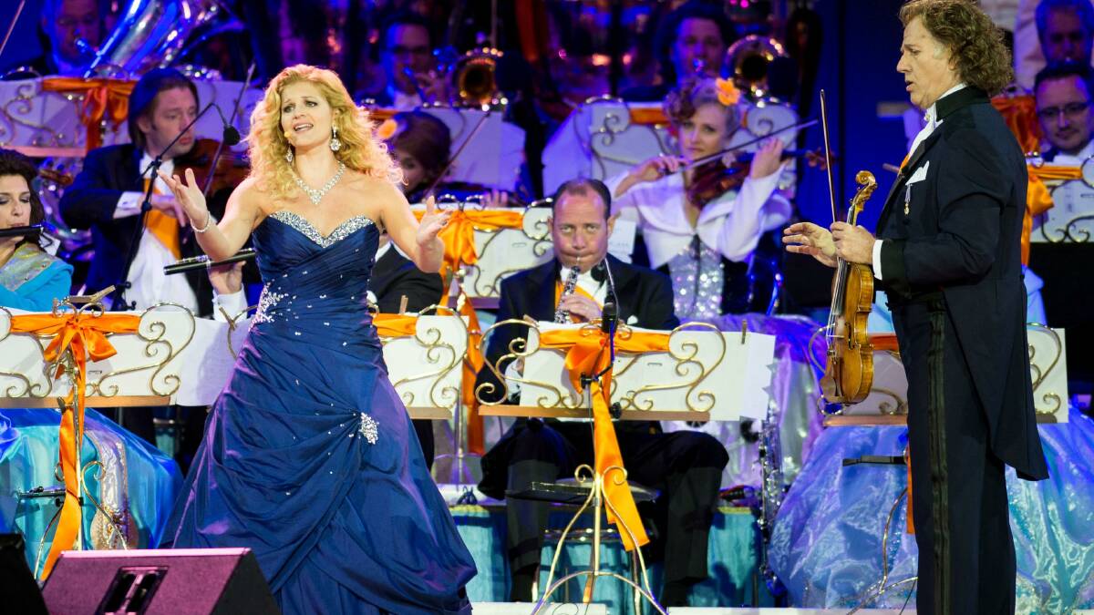 Birkdale Soprano Mirusia Louwerse and Andre Rieu perform on stage at Museumplien during the inauguration of King Willem Alexander of the Netherlands as Queen Beatrix of the Netherlands abdicates on April 30 in Amsterdam, Netherlands. (Photo by Ian Gavan/Getty Images)
