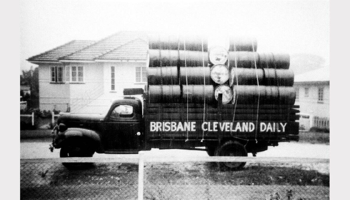 Banks Transport, loaded with empty fuel drums, headed for Brisbane before the days of fuel tankers at leveland, taken from 17 Homer St in heavy rain in 1959