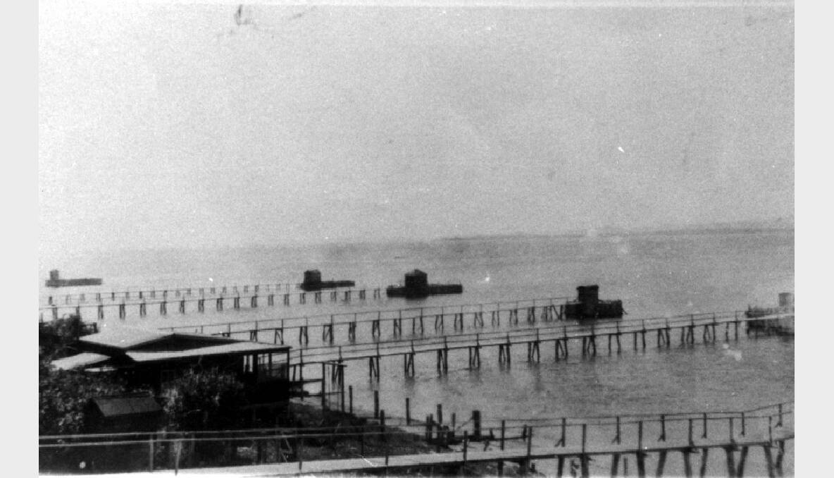 These are some of the jetties that used to line Cleveland Point. These jetties had bathing enclosures and small changing sheds on the end. This photo was taken about 1940.  Photos courtesy of Redland City Council Local History and Heritage Library
