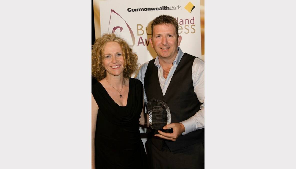 Redland City Chamber of Commerce committee member Anita Beasley with Mick Bentham of Certified Roofing winners of Excellence in Construction in the 2012 Commonwealth Bank Redland Business Awards.