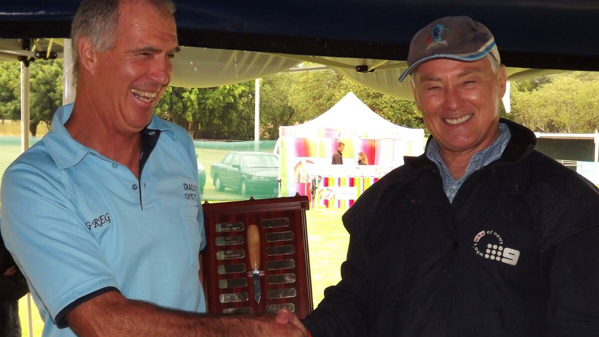 Greg receives his Bayside Bulletin shield from host Bruce Paige at Straddie Oyster Festival at Dunwich 