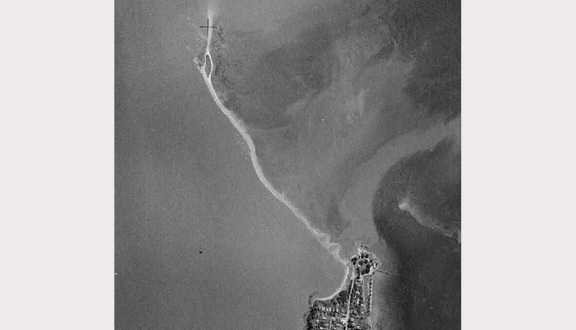 The earliest aerial image of King Island off Wellington Point taken in 1958. The island shows vegetation on both east and west sides of the island.